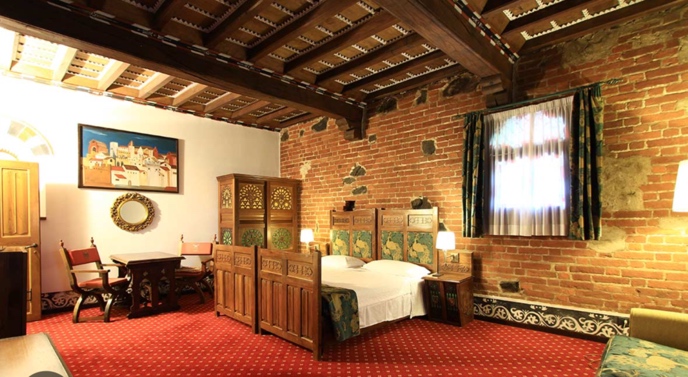 A guest room at Castello di Pavone