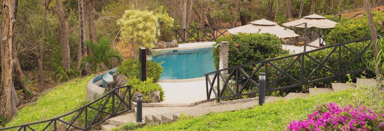 A pool surrounded by lush gardens in Costa Rica